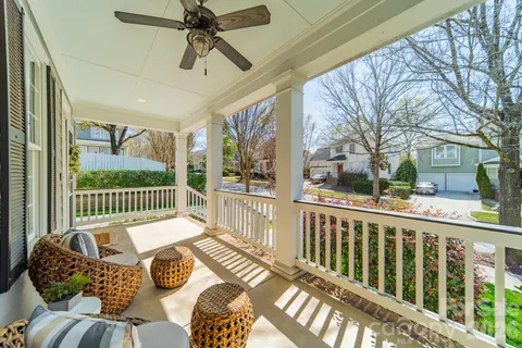 a balcony view with a seating space