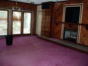 3277 Startown Road Newton, NC 28658 - Photo 2 of 9 a view of an empty room with a fireplace and a window