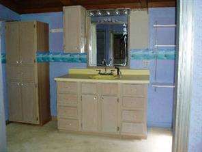 3277 Startown Road Newton, NC 28658 - Photo 7 of 9 a bathroom with a granite countertop sink and a mirror