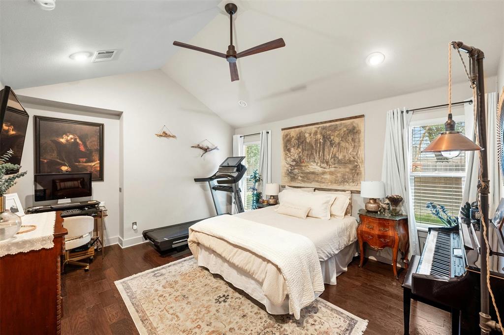 2802 Warren Street, Unit A Austin, TX 78703 - Photo 19 of 29 a bedroom with a bed a couch and large window