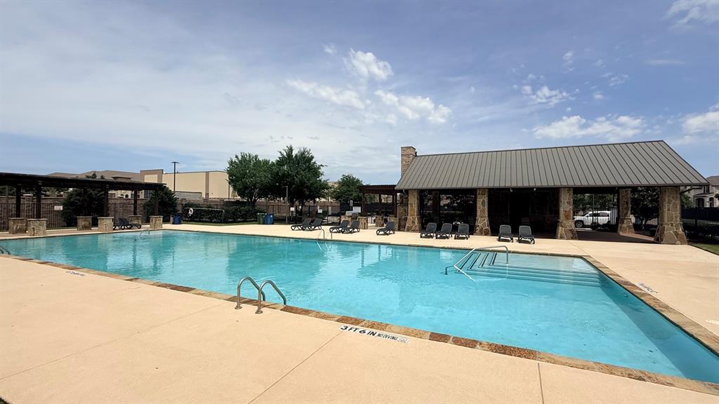 337 Prairie Ridge Lane Lewisville, TX 75056 - Photo 25 of 28 a view of a swimming pool with outdoor seating and plants