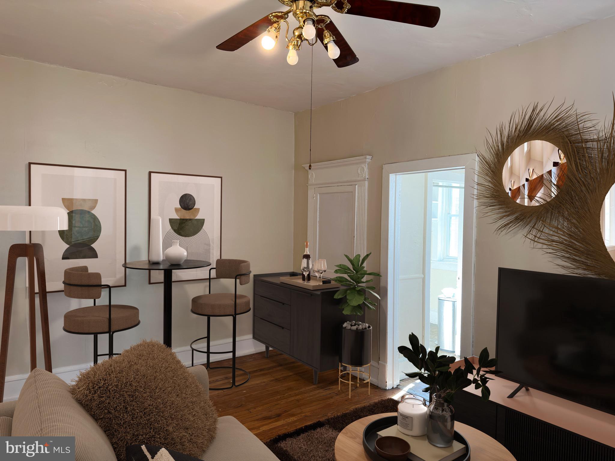 5418 Walnut Street Philadelphia, PA 19139 - Photo 3 of 7 a living room with furniture potted plant and a fireplace