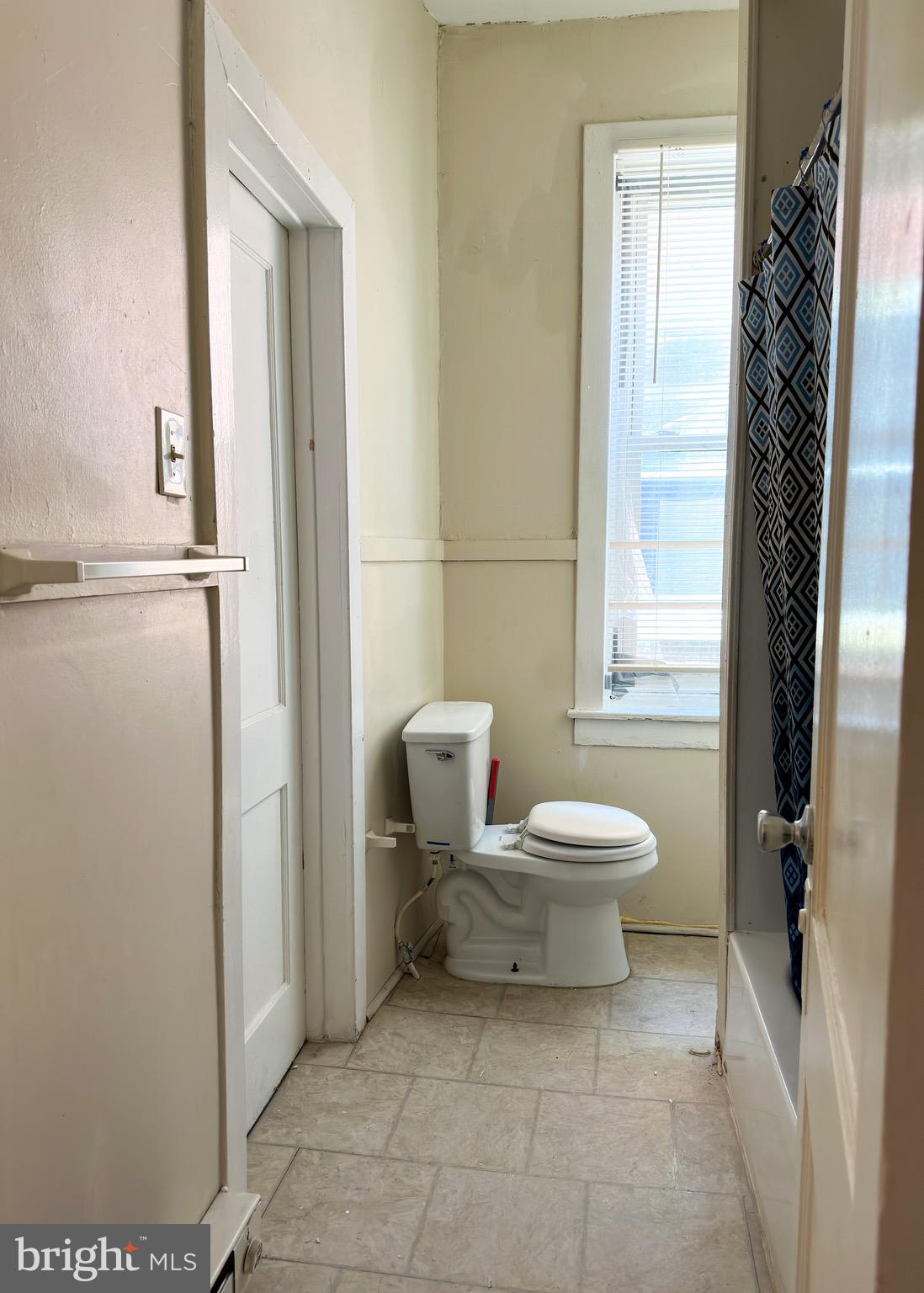 5418 Walnut Street Philadelphia, PA 19139 - Photo 7 of 7 a bathroom with a toilet sink and a window