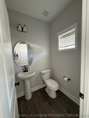 390 Summerhill Road Fayetteville, NC 28303 - Photo 9 of 27 a bathroom with a toilet sink and mirror