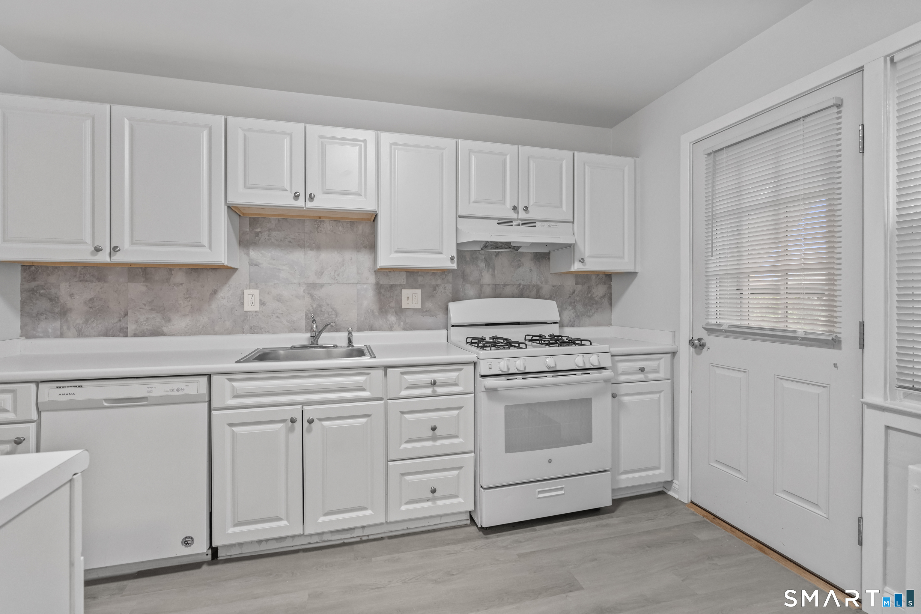 110 Blachley Road, Unit A Stamford, CT 06902 - Photo 1 of 26 Photos are of a mirror image of the unit. Finishes may vary.
