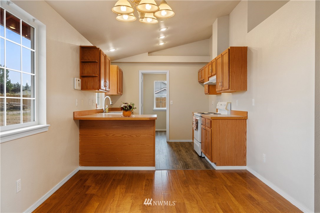 18126 Leitner Road Southwest Rochester, WA 98579 - Photo 11 of 29 a view hallway with wooden floor and cabinet