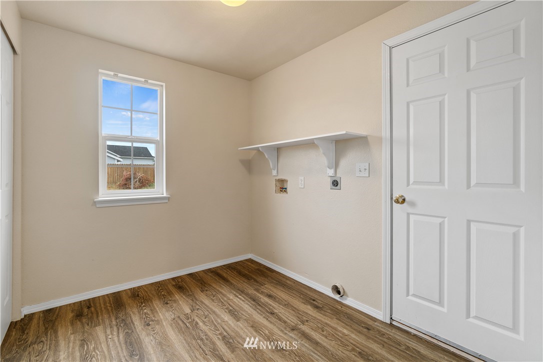 18126 Leitner Road Southwest Rochester, WA 98579 - Photo 15 of 29 a view of an empty room with wooden floor and a window