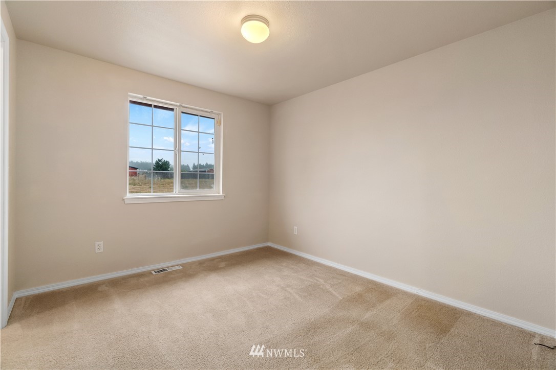18126 Leitner Road Southwest Rochester, WA 98579 - Photo 26 of 29 an empty room with windows