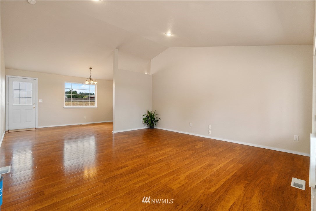 18126 Leitner Road Southwest Rochester, WA 98579 - Photo 10 of 29 a view of an empty room and wooden floor
