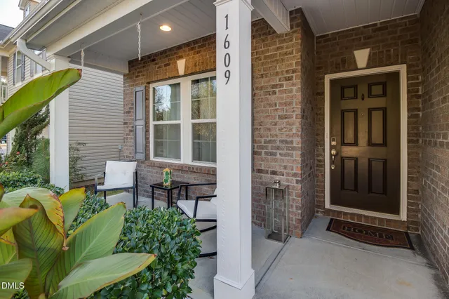 a backyard of a house with outdoor seating