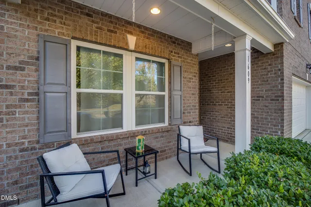 a wooden bench sitting in front of a building