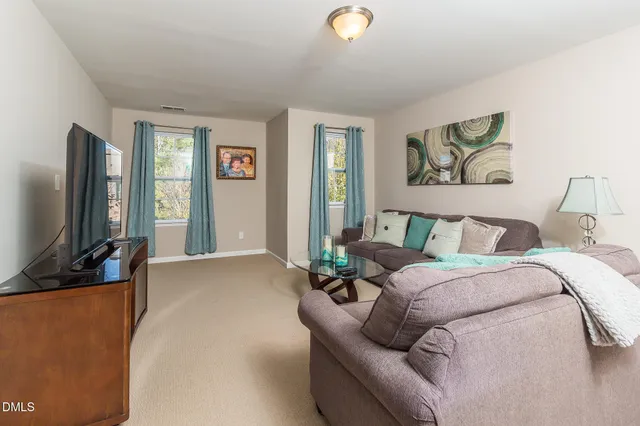 a living room with a couch and a flat screen tv