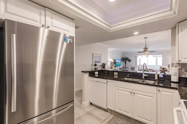 a kitchen with stainless steel appliances a refrigerator and a sink