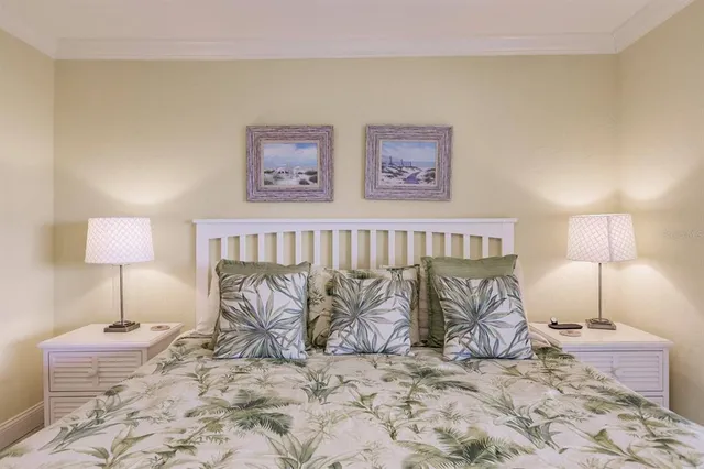 a bedroom with a bed and a lamp