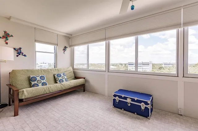 a bedroom with furniture and a window