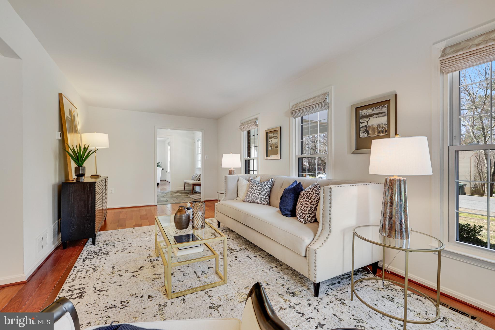 1807 Post Oak Trail Reston, VA 20191 - Photo 8 of 79 a living room with furniture a rug and a table