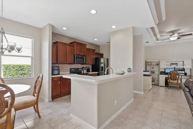 a view of kitchen with cabinets and stainless steel appliances