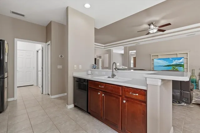 a spacious bathroom with a granite countertop sink a mirror and a shower