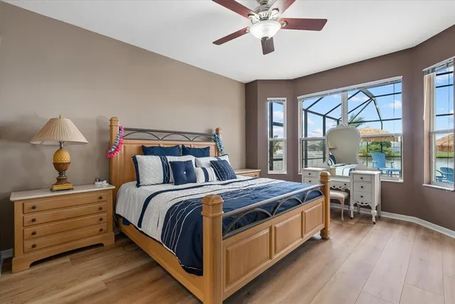 a bed room with a bed and a chandelier