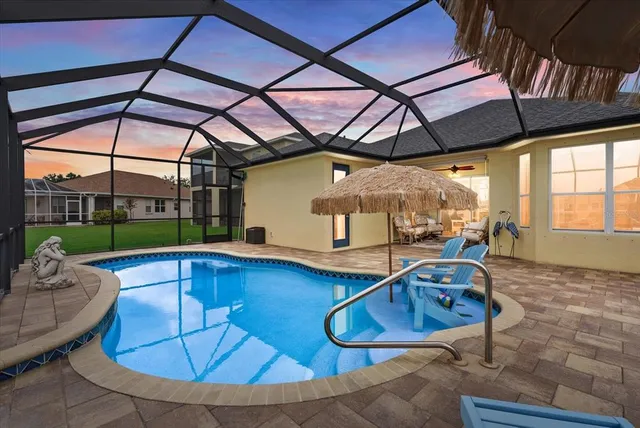 a view of a swimming pool with a patio
