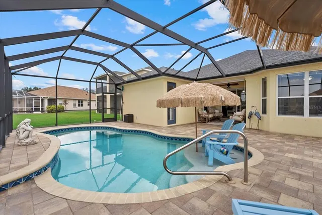 a view of a swimming pool with a porch