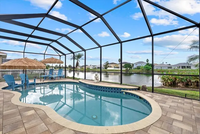 a view of a lake with houses in the back