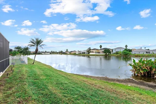 an aerial view of a house with a lake view