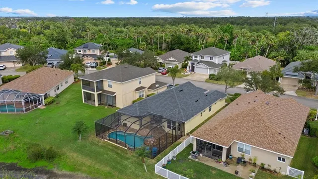 an aerial view of a house with outdoor space and street view