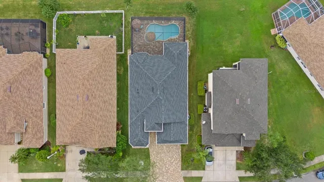 a aerial view of a house with a yard