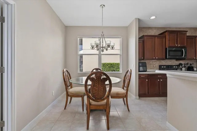 a view of a dining room with furniture window and outside view