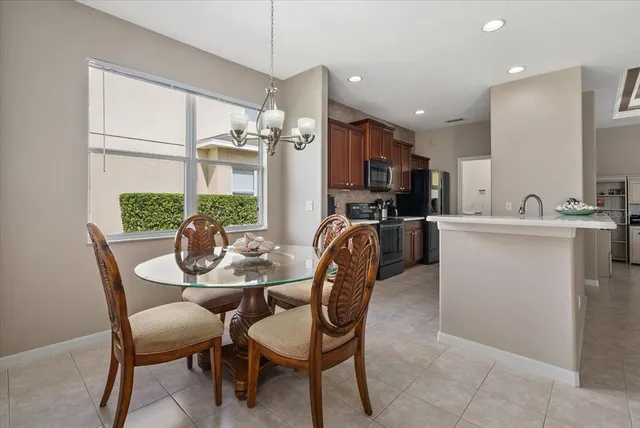 a view of a dining room with furniture window and outside view
