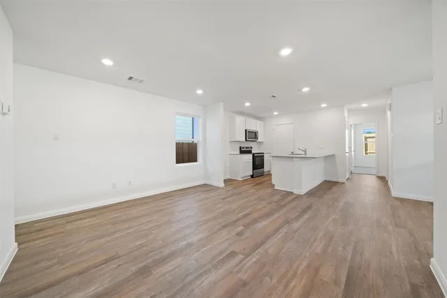 a view of kitchen with wooden floor