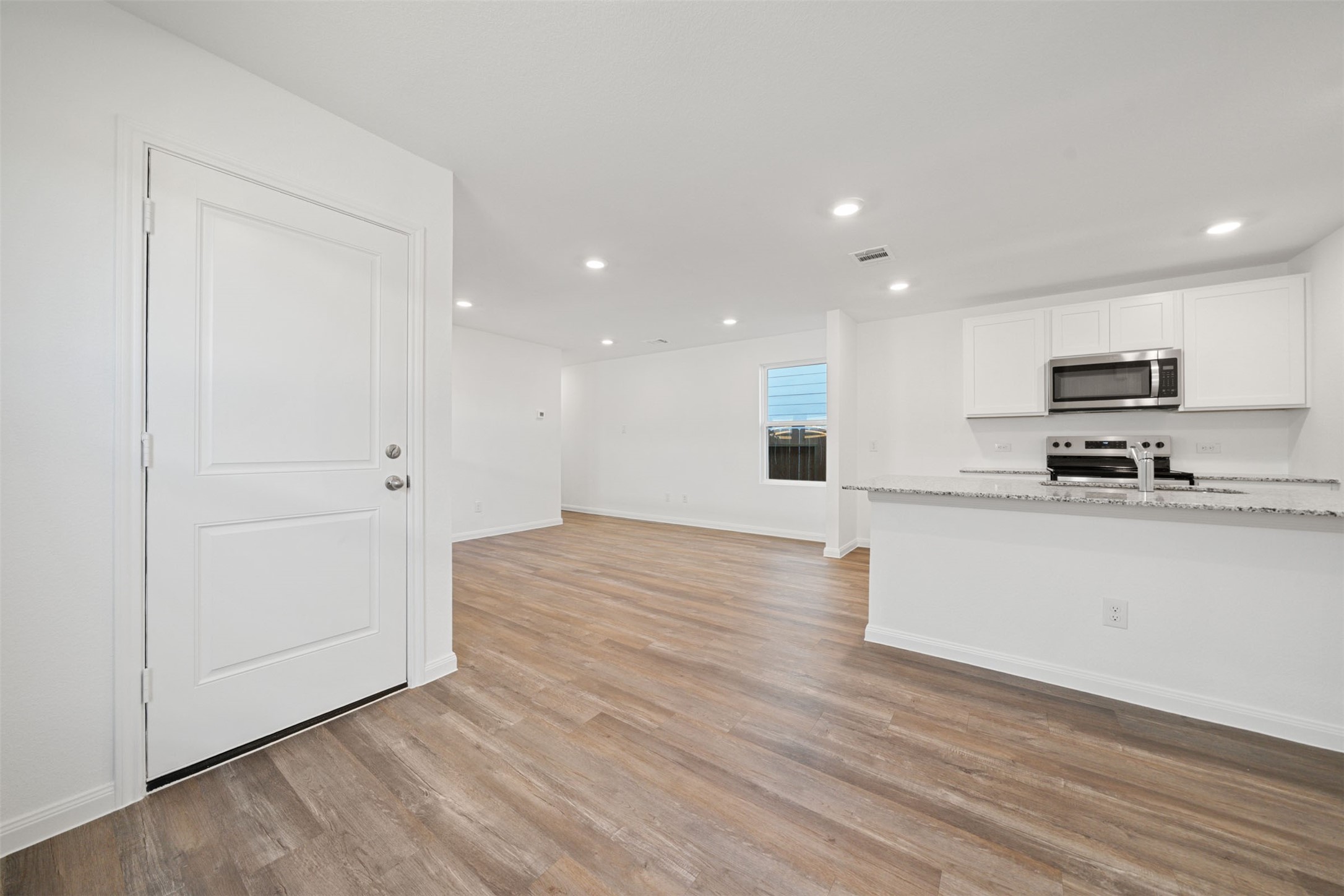 12327 Sword Point Court Willis, TX 77378 - Photo 15 of 30 a view of kitchen with wooden floor and electronic appliances