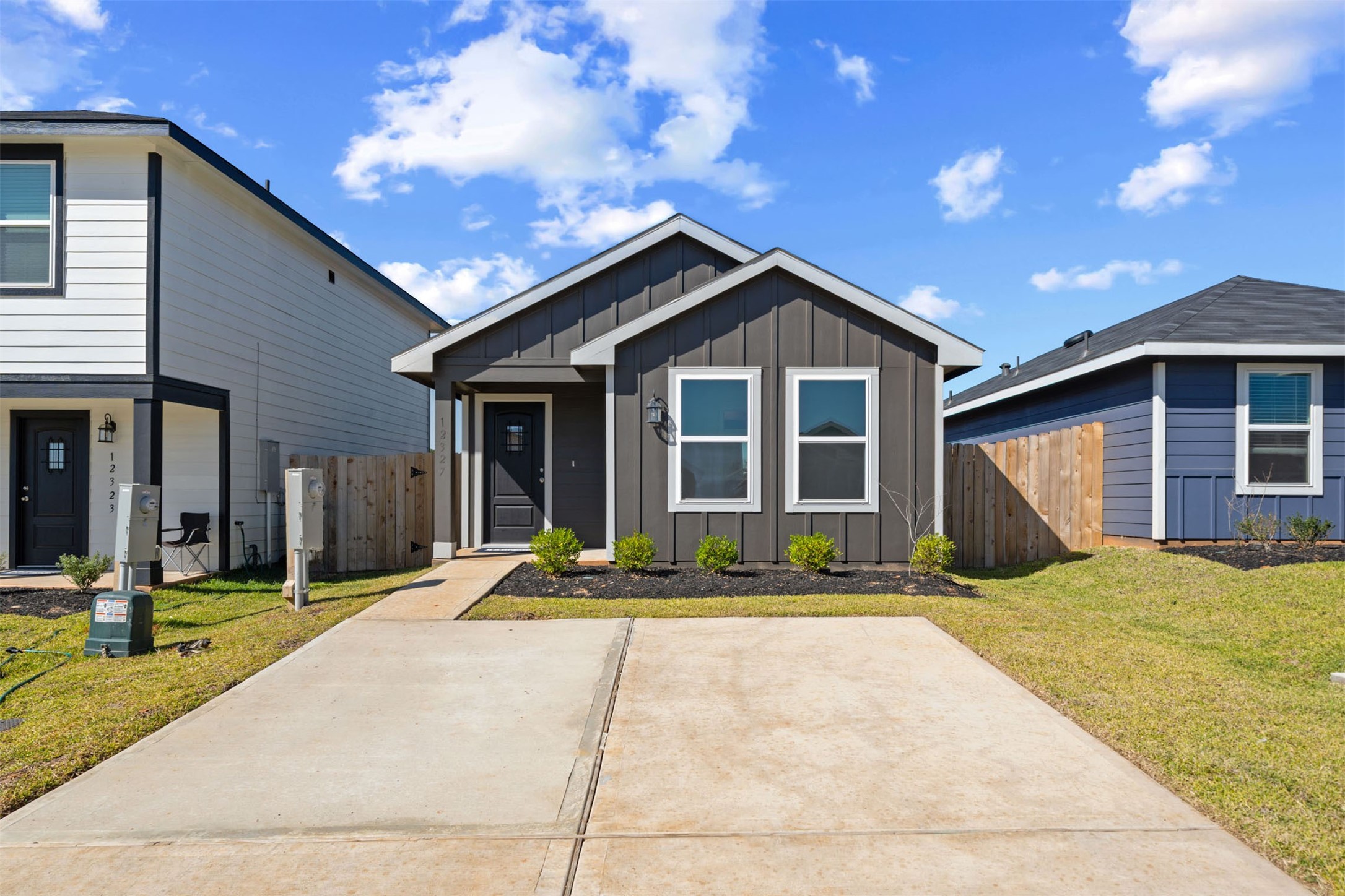 12327 Sword Point Court Willis, TX 77378 - Photo 2 of 30 a front view of a house with a yard