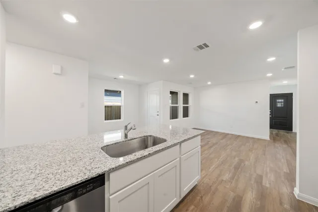 a kitchen with granite countertop a sink and a granite counter tops