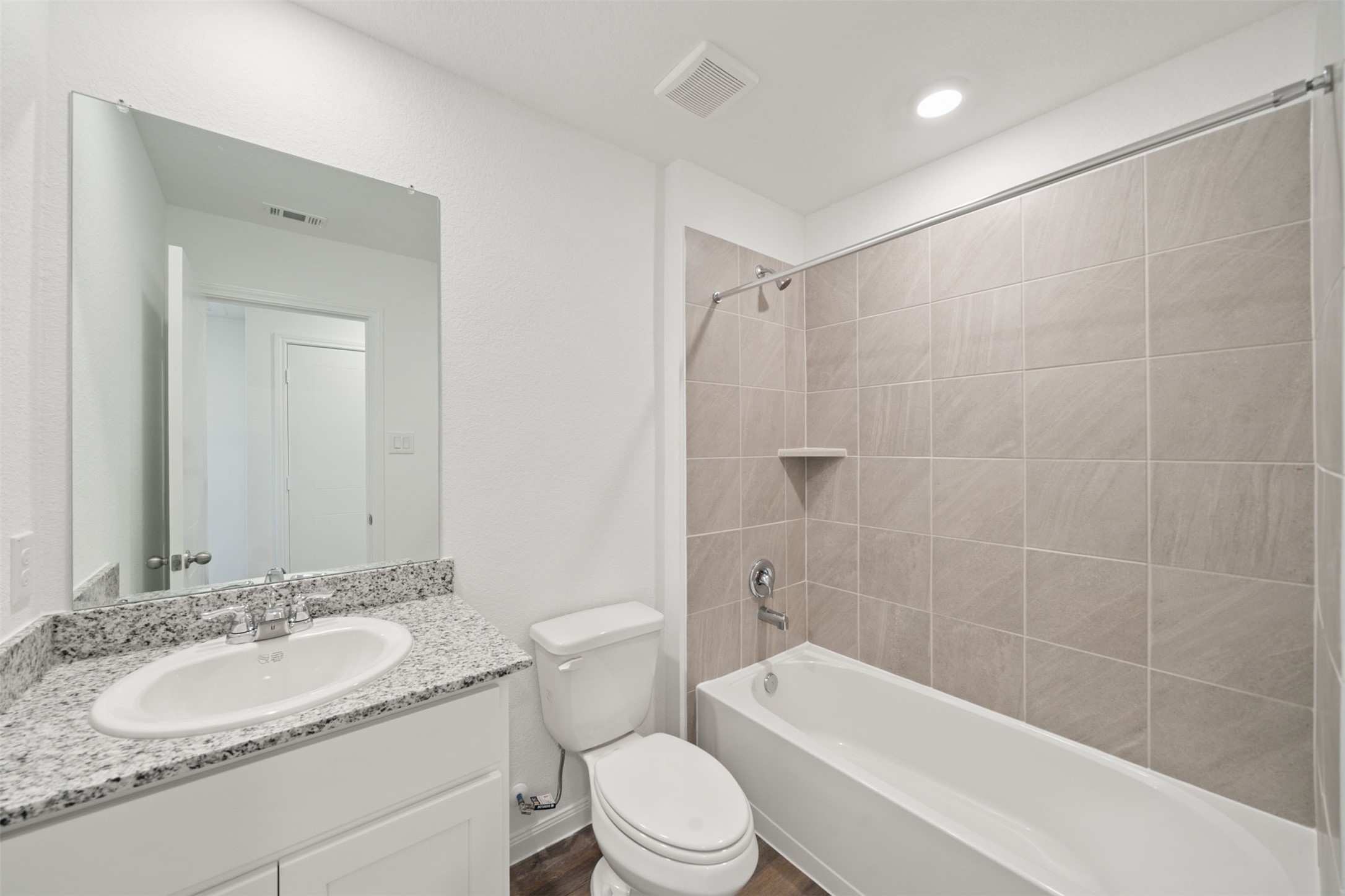 12327 Sword Point Court Willis, TX 77378 - Photo 23 of 30 a bathroom with a sink toilet and shower