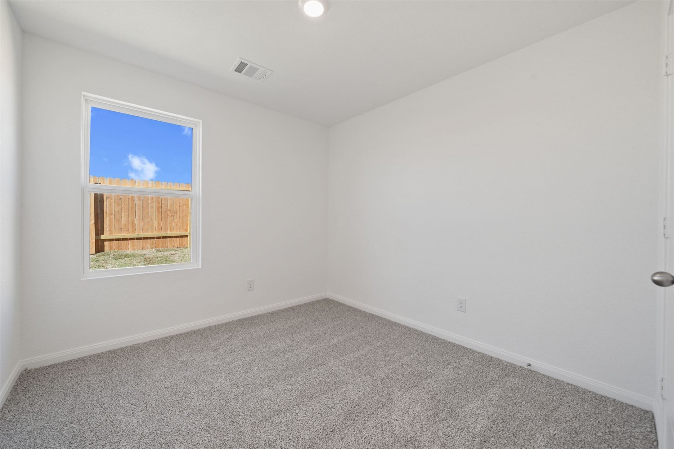 12327 Sword Point Court Willis, TX 77378 - Photo 24 of 30 an empty room with a window