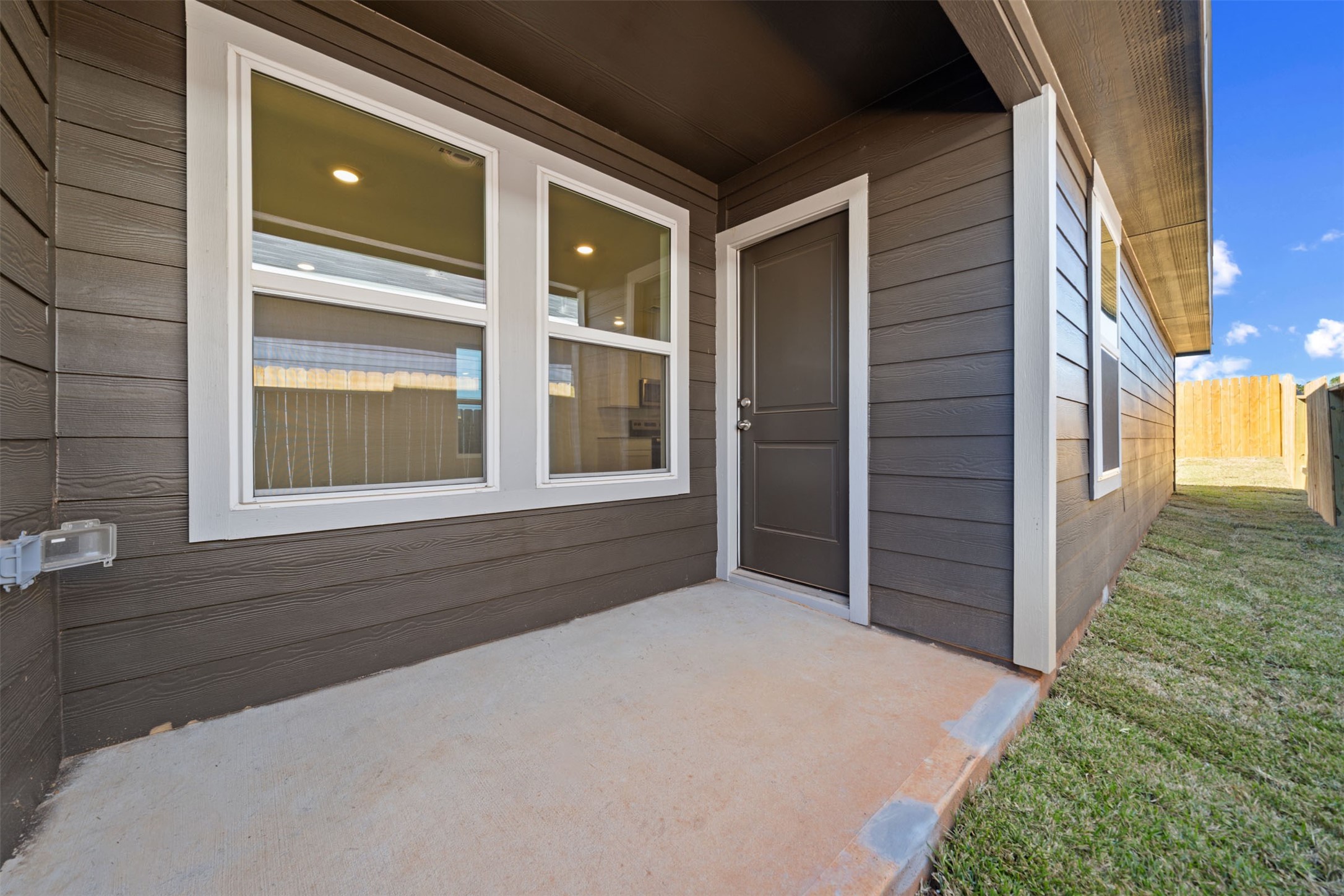 12327 Sword Point Court Willis, TX 77378 - Photo 28 of 30 a front view of a house with a yard