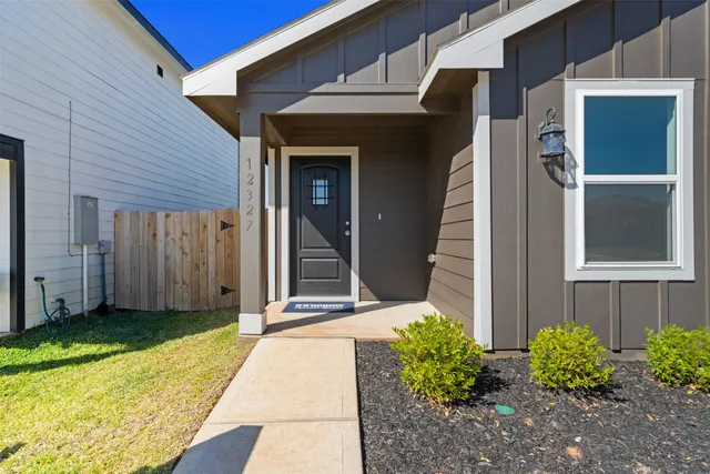a view of a house with a garden