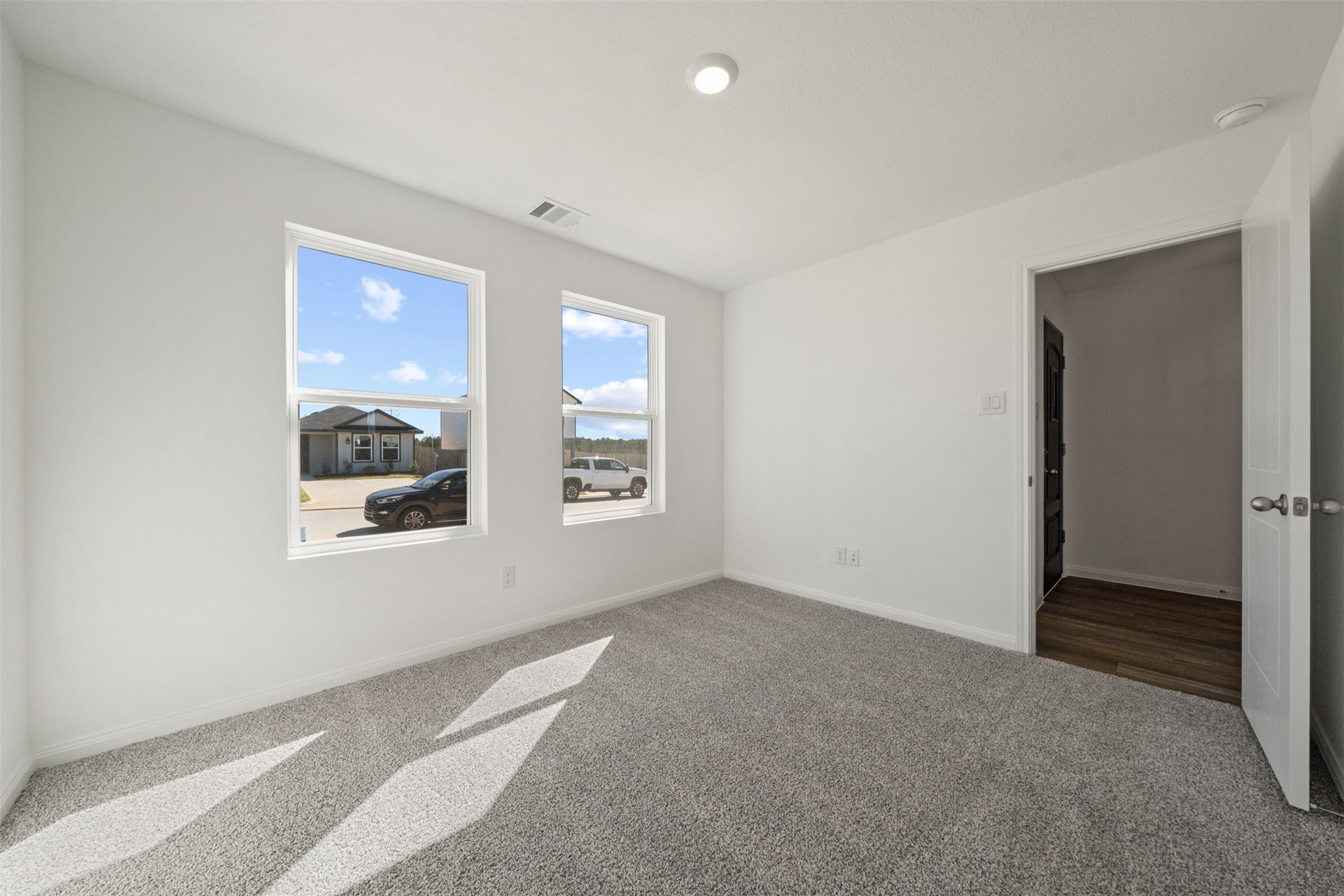 12327 Sword Point Court Willis, TX 77378 - Photo 8 of 30 an empty room with windows