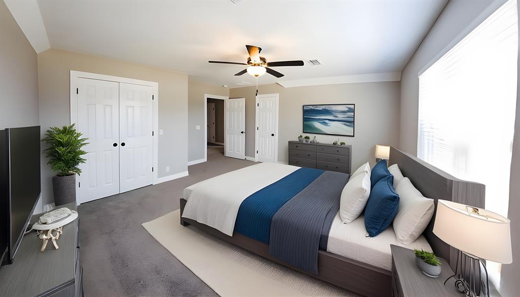 990 Baylor’s Way Reno, TX 75462 - Photo 14 of 22 a spacious bedroom with a bed and a chandelier