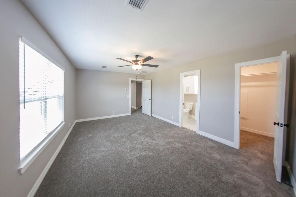 990 Baylor’s Way Reno, TX 75462 - Photo 16 of 22 a view of a livingroom with a ceiling fan and window