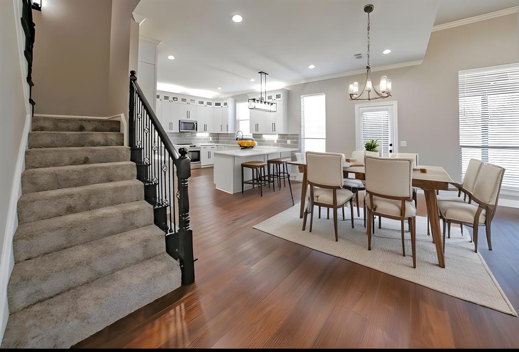 990 Baylor’s Way Reno, TX 75462 - Photo 8 of 22 a view of a dining room with furniture and wooden floor