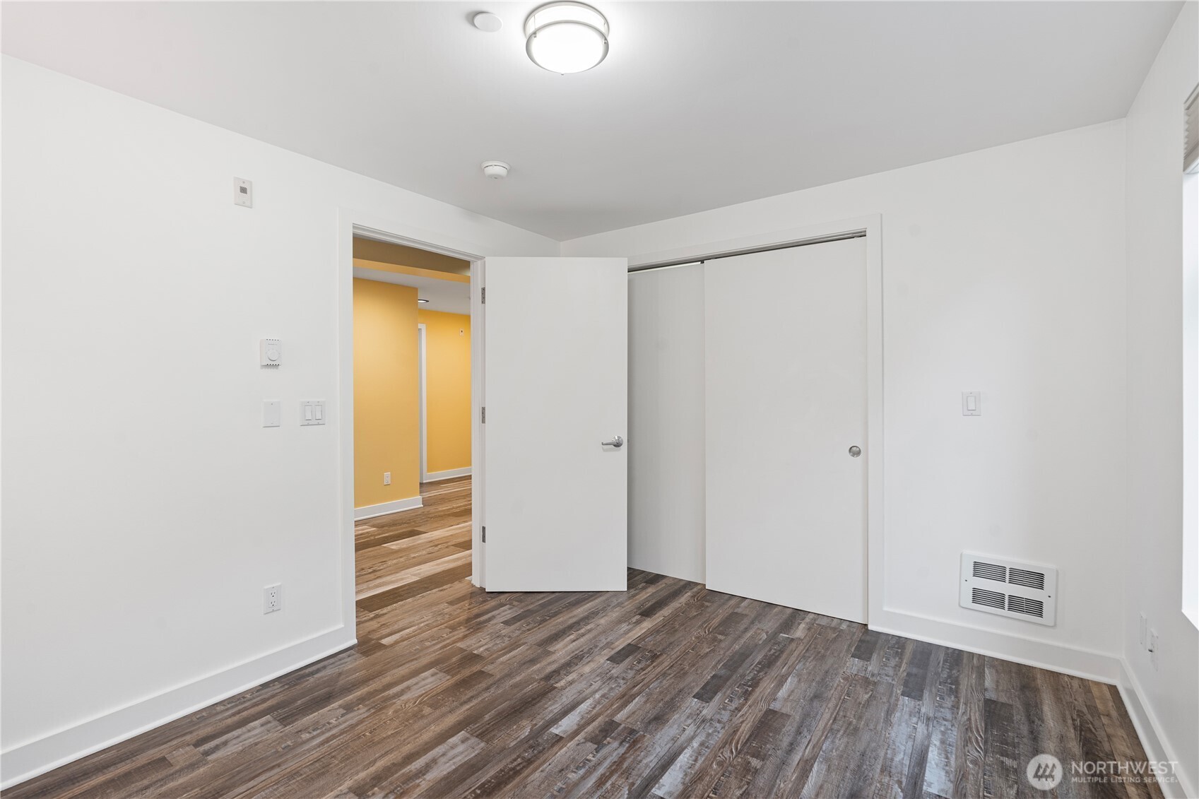 2731 Boylston Avenue East, Unit 300 Seattle, WA 98102 - Photo 12 of 36 a view of empty room with wooden floor