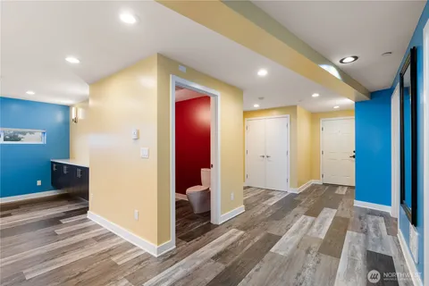 a view of room with window and wooden floor