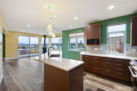 a kitchen with a sink and a large window