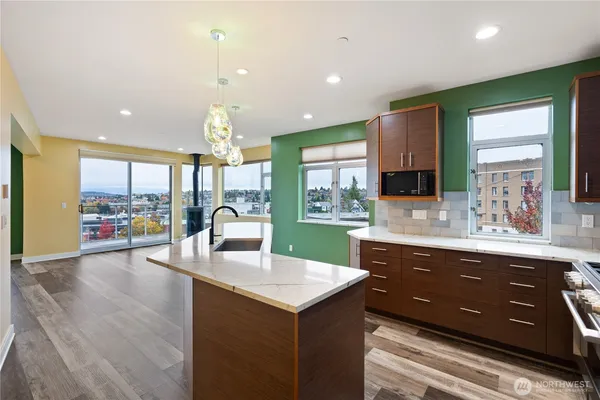 a kitchen with a sink and a large window