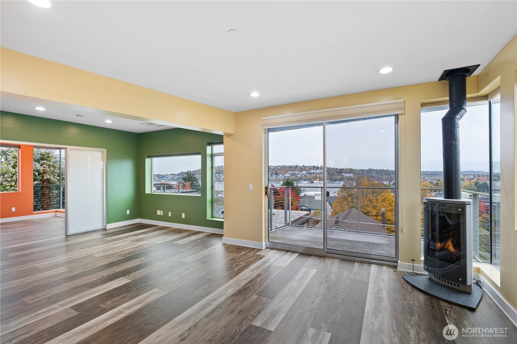 2731 Boylston Avenue East, Unit 300 Seattle, WA 98102 - Photo 21 of 36 a view of an empty room with wooden floor and a window