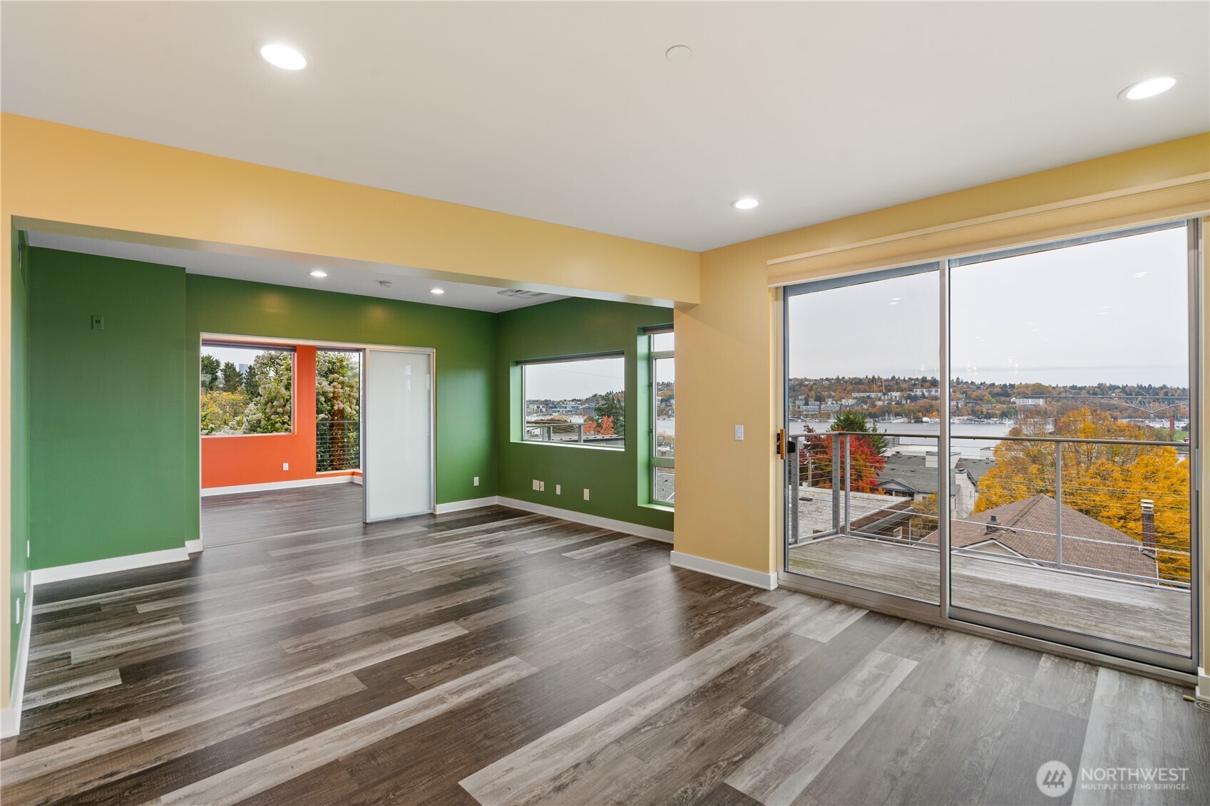 2731 Boylston Avenue East, Unit 300 Seattle, WA 98102 - Photo 23 of 36 an empty room with wooden floor and windows