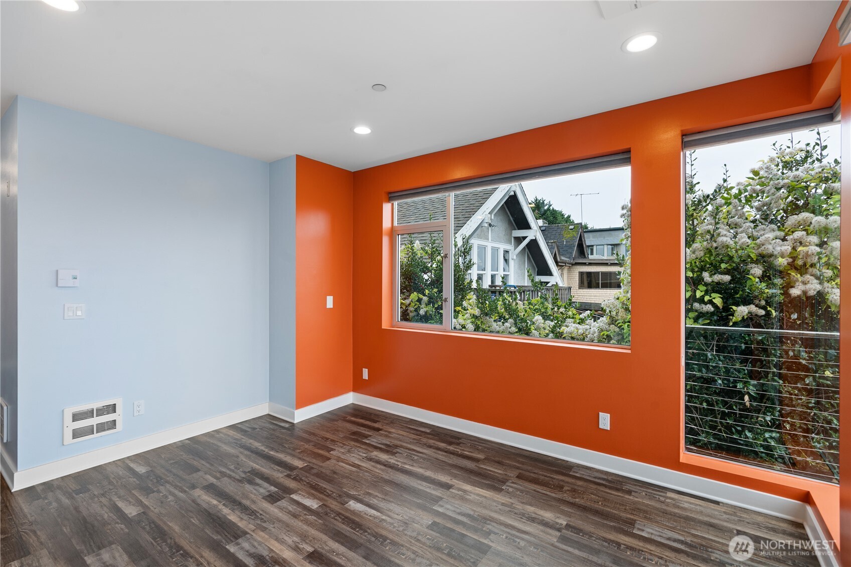 2731 Boylston Avenue East, Unit 300 Seattle, WA 98102 - Photo 27 of 36 an empty room with wooden floor and a window